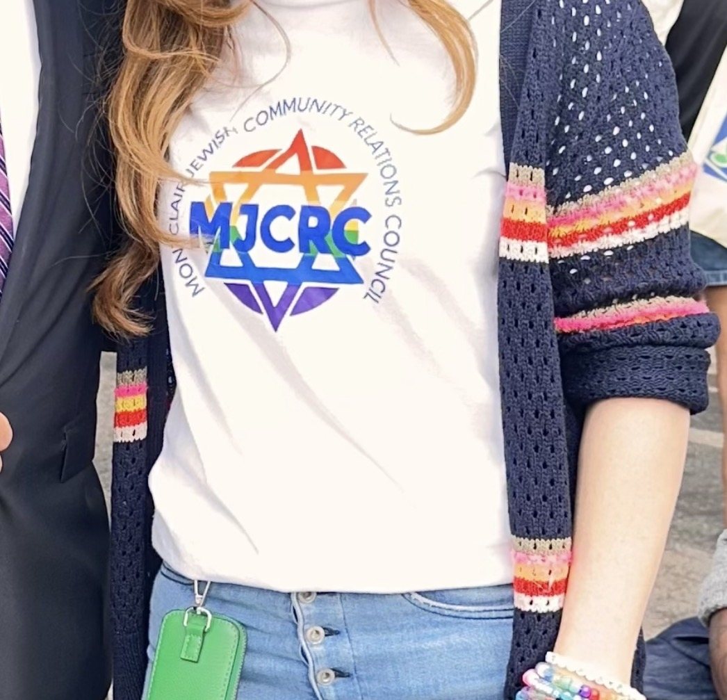 Custom nonprofit fundraiser tee printed by KSTMYZE, worn at a community Pride event in Montclair, New Jersey